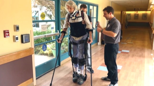 Paralyzed man takes first steps after accident