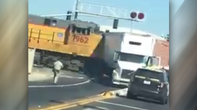 Moment of impact: Train smashes into truck stuck on track