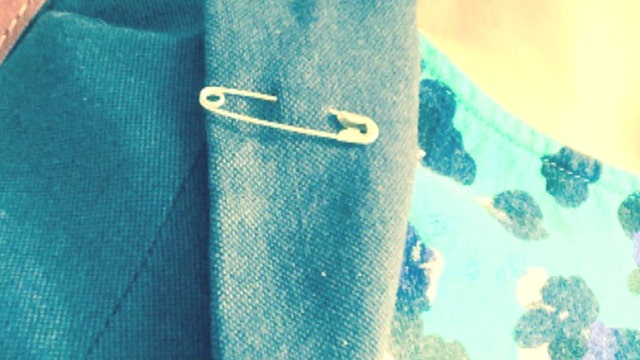Anti-Trump groups rise up with... safety pins