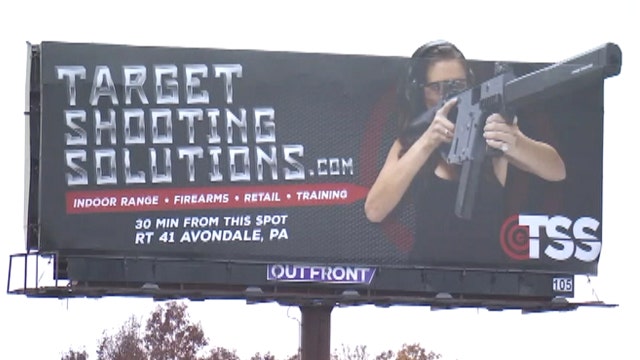 Gun store's controversial billboard has residents up in arms