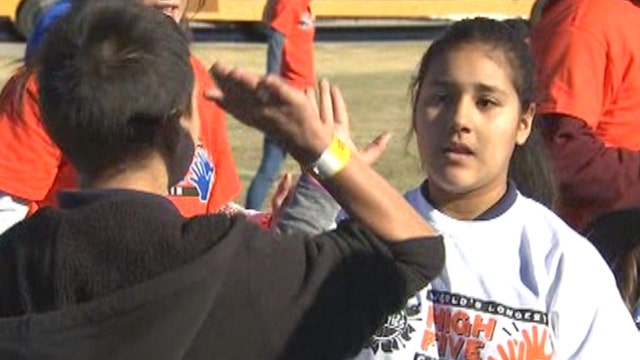 Kids look to break record for longest high-five chain