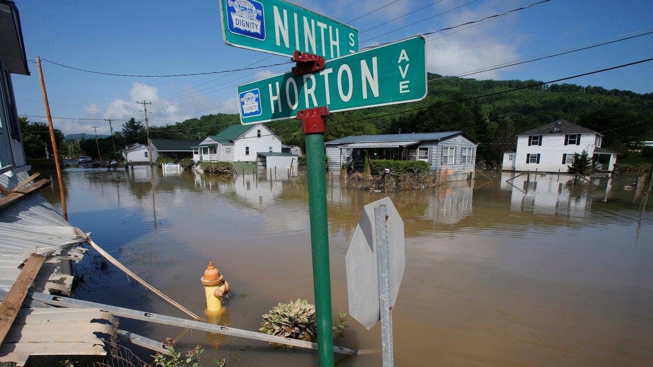 Flood-ravaged West Virginia braces for more rain as sheriff warns of looting