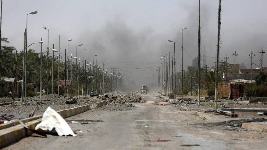 Iraqi troops retake city after month-long combat blitz