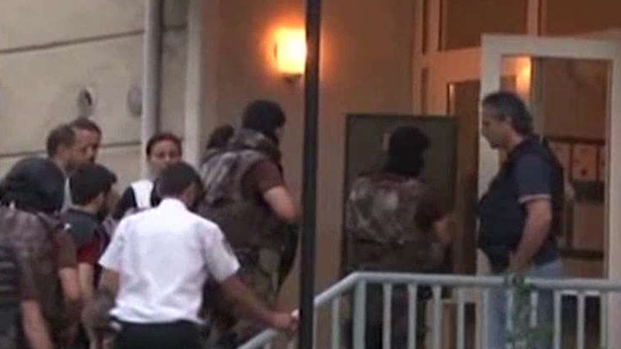 Officials have arrested 13 suspects following a series of raids