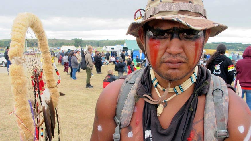 Protesters argue the permitted oil pipeline near an American Indian reservation will impact drinking water for thousands of tribal members; insight from Lauren Donovan, reporter for The Bismarck Tribune