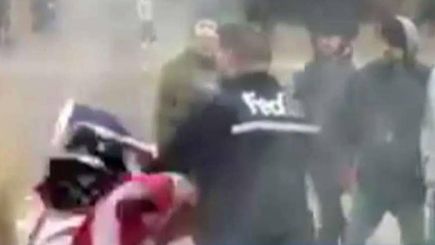 FedEx driver puts out burning flags in Iowa