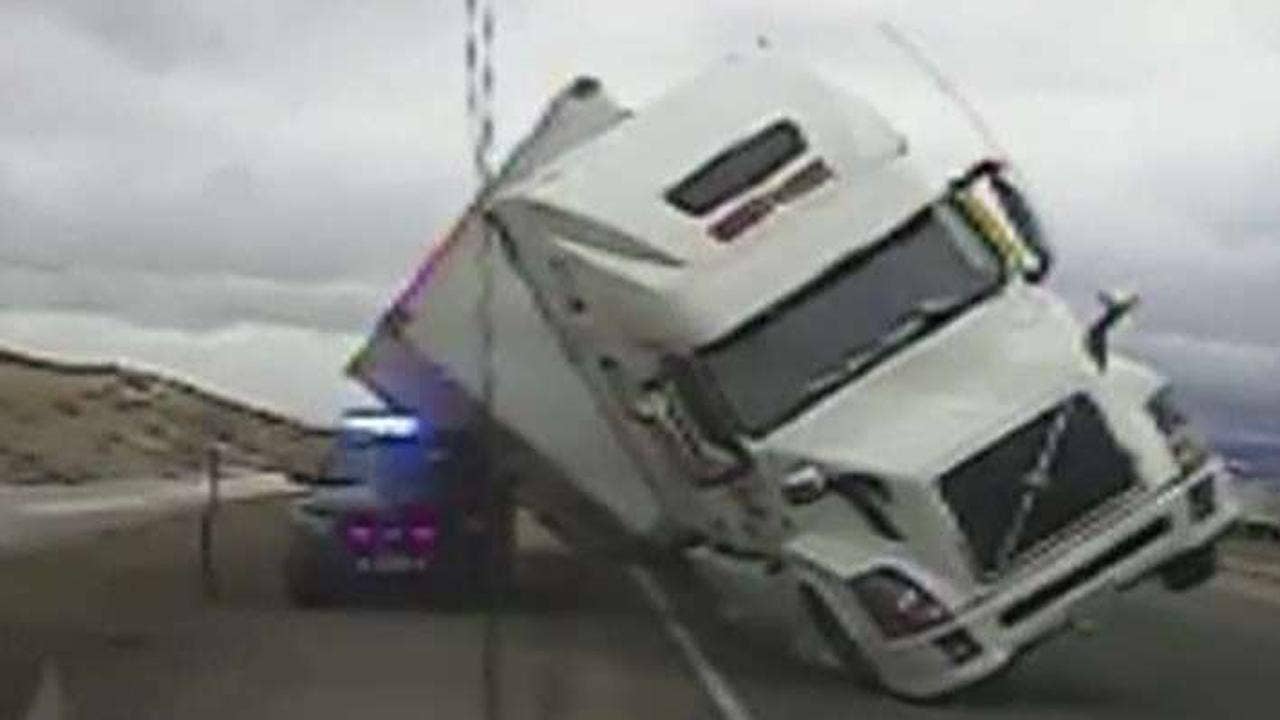 Semi-truck crushes Wyoming cop cruiser in viral video