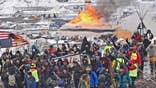 Dakota pipeline camp raided after protesters defy deadline, refuse to leave