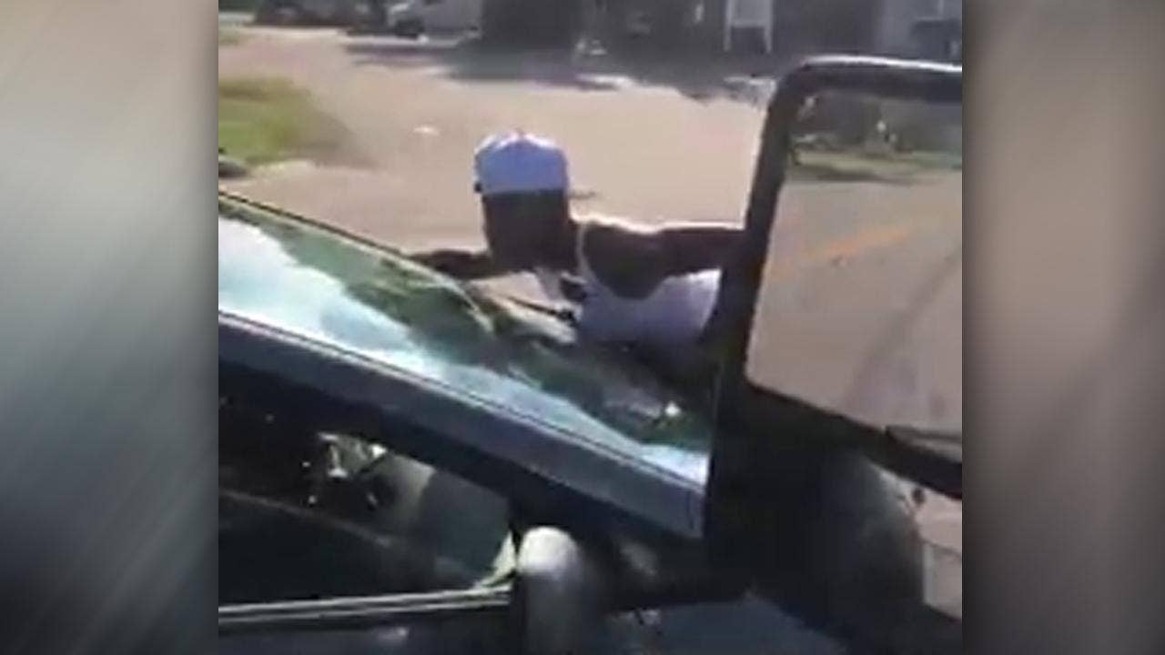 Virginia woman holds onto hood of moving vehicle, video shows