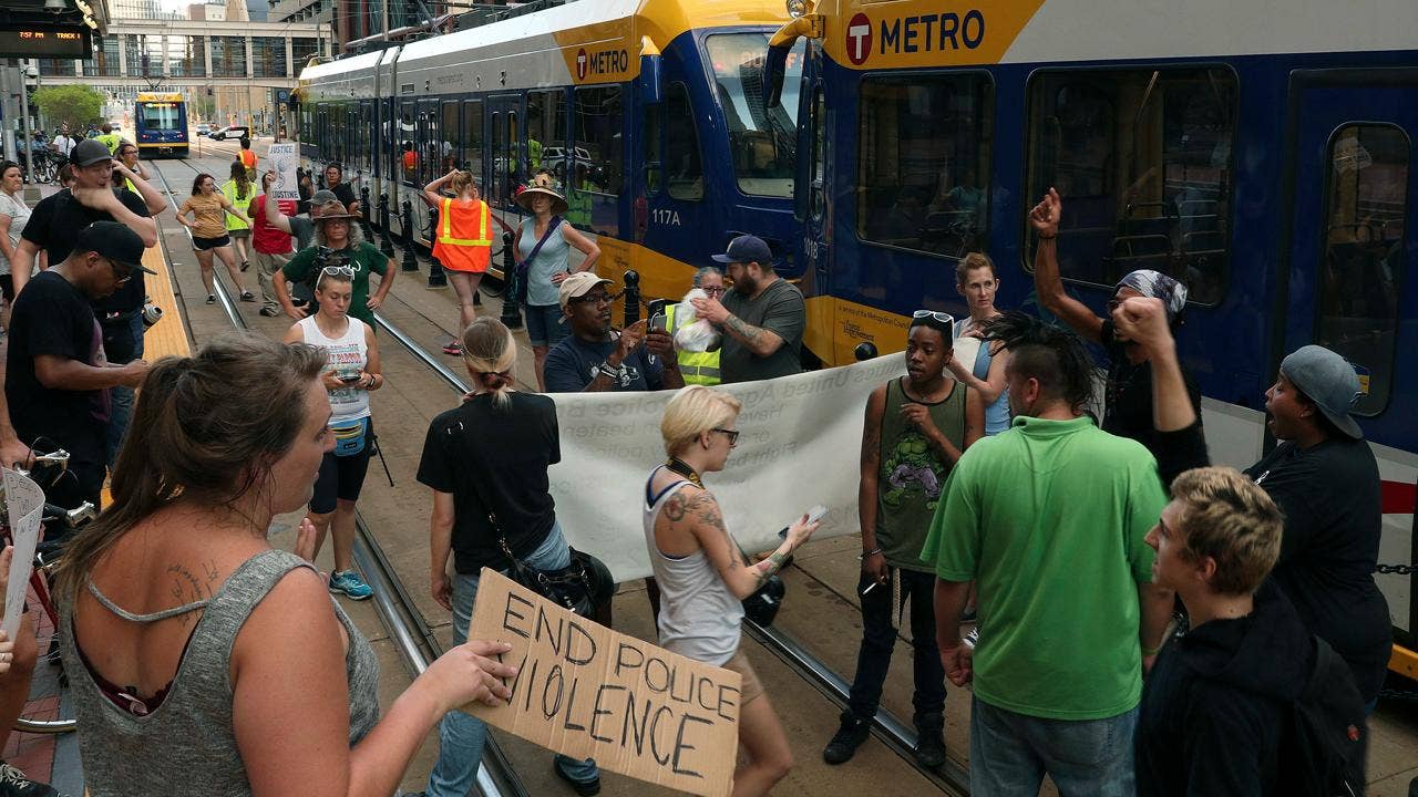 Father of Australian woman shot and killed by officer says she was &lsquo;ripped from our arms&rsquo;