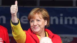 Germany's Social Democratic Party said Sunday its members have voted in favor of joining a coalition with Angela Merkel's conservative bloc, clearing the last major hurdle to the formation of a new government and a fourth term for the veteran German chancellor.