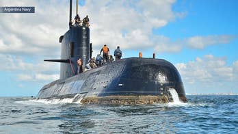 Sister of missing sailor claims the doomed Argentinian submarine was being chased by a British helicopter and Chilean ship shortly before disappearing.