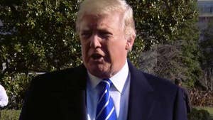 The president speaks with reporters before departing for Camp David.