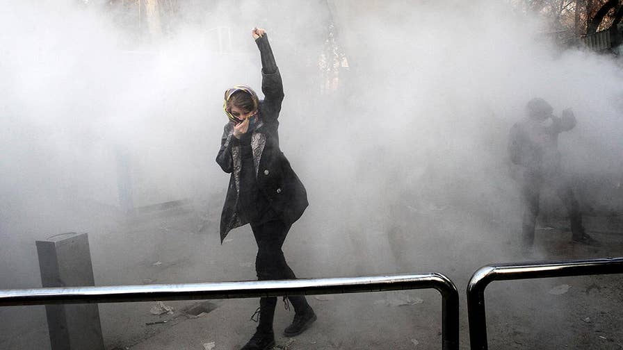 At least 12 people killed, hundreds arrested in anti-government protests in Iran; Conor Powell reports from Jerusalem.