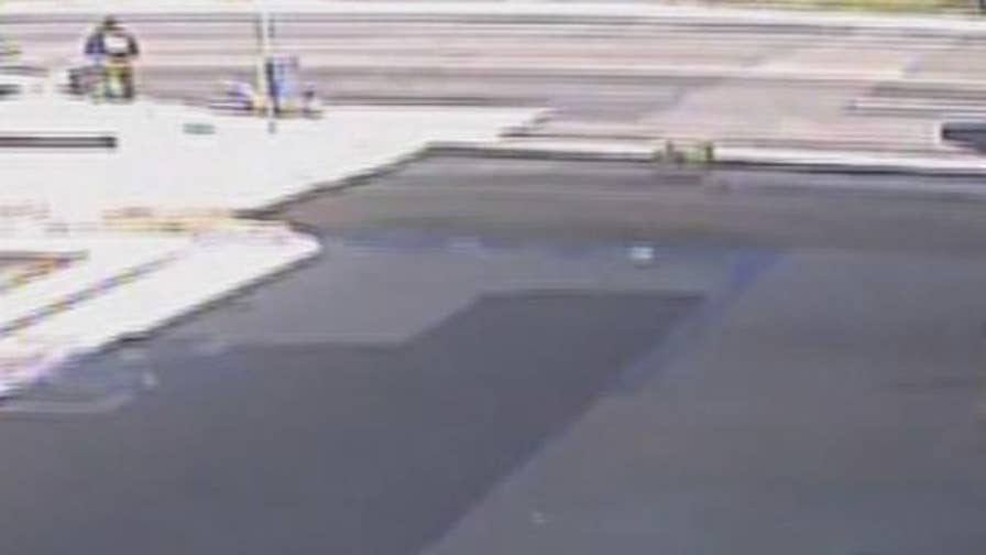 Surveillance video shows Alonzo Leron Smith punching San Bernardino County sheriff's Deputy Larry Falce after rear ending him.