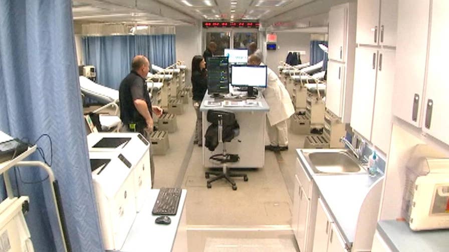 Specialized trailer located outside emergency room at Grady Memorial Hospital has space for 14 beds.