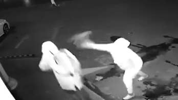 A duo of suspected would-be thieves try to break a window in a burglary attempt, but in the process may have broken something else. Watch as one of the men accidentally throws a brick at his partner's head and had to drag him away.