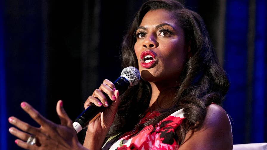 In a revealing clip released by CBS, while talking on "Big Brother: Celebrity Edition," Omarosa claims that she was shunned by White House officials because she is a black woman. She also spoke out about a potential tell-all book and what she really thinks of Trump's tweeting. 