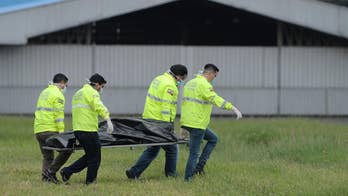 Raw video: Officials in Ecuador investigate scene after two men fall from New York-bound plane's landing gear.