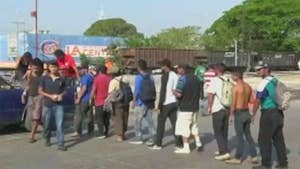 Group of immigrants is guided by People without Borders, a U.S. non-profit; William La Jeunesse reports.