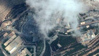 Satellite imagery appears to show flattened structures; Mike Tobin reports from Jerusalem.
