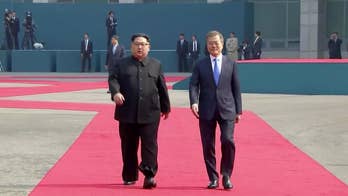 North Korean leader crosses DMZ line in effort to reduce hostility