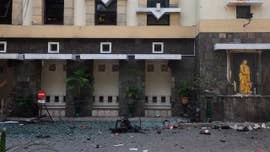 Six suicide bombers from one family — including children and teens — rode in on motorcycles and attacked three churches in Indonesia during Sunday Mass, killing at least 13 people and wounding dozens more, police and media reports said.