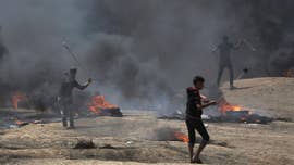 At least 58 people were killed, including a baby who died from tear gas inhalation, during a chaotic scene at the Gaza border where Palestinians protested the U.S. Embassy opening in Jerusalem on Monday, the Gaza Health Ministry said.