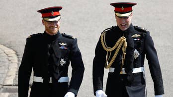 Royal groom and his best man greet cheering well-wishers in Windsor, England as they crossed the grounds of the 15th-century church for Prince Harry's royal wedding American actress Meghan Markle.
