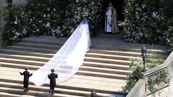 Cheering crowds, church bells greet the American actress as she arrives at St. George's Chapel in Windsor, England for her wedding to Prince Harry.