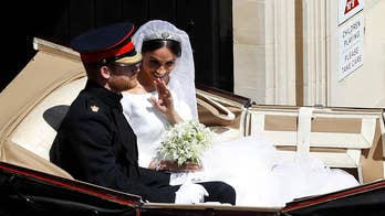 Horse-drawn Ascot Landau carriage carries Prince Harry and Meghan Markle from St. George's Chapel to Windsor Castle for their reception.