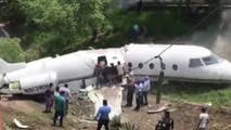 Honduran citizens pull survivors from the wreckage of a private jet that crashed in Honduras after leaving Texas.
