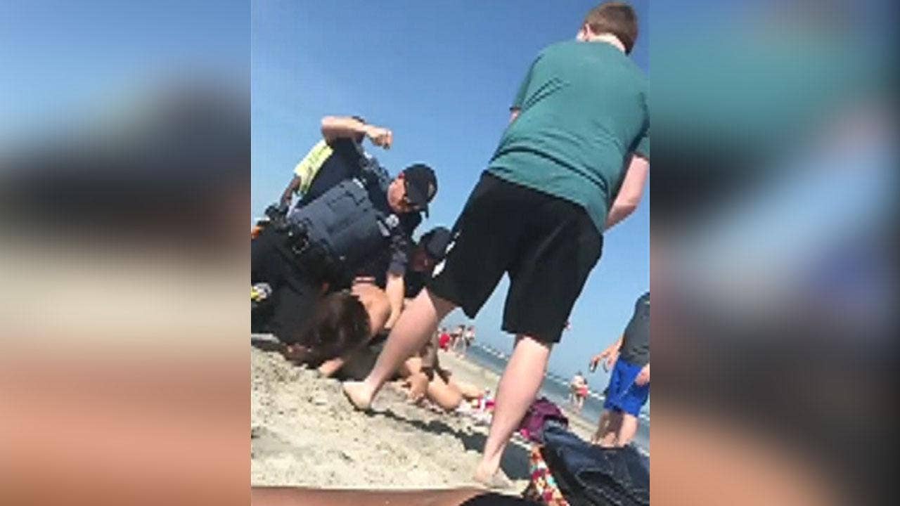 NJ officer seen punching woman in the head during arrest at popular beach; police investigate