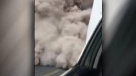 A Guatemala police officer attempting to escape the dooming cloud of ash rushing toward him captured the moment the Volcan del Fuego erupted, sending people fleeing by foot and car before the thick, gray dust engulfs them.