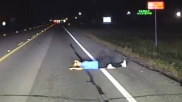 Intoxicated woman sleeping on Texas road narrowly escapes being hit by cars, dashcam video shows