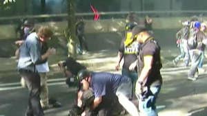 Image result for Antifa members in Berkeley smash windows of US Marine Corps recruiting office during protest