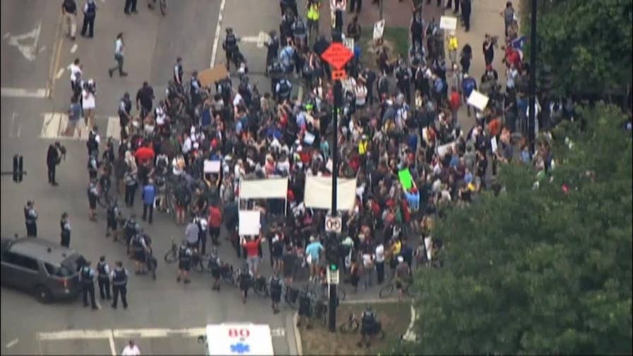 Chicago protesters marched to Wrigley Field to raise awareness of the city's crime crisis. 