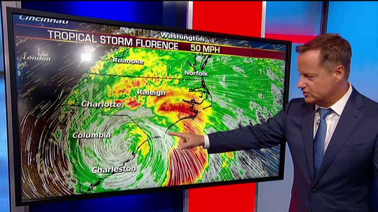 Weather Channel defends reporter captured swaying in Florence winds as 2 people walk behind him