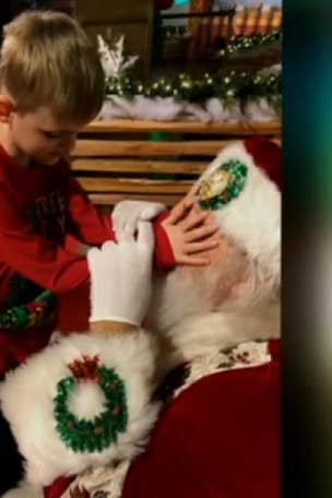 Heartwarming moment blind boy meets Santa