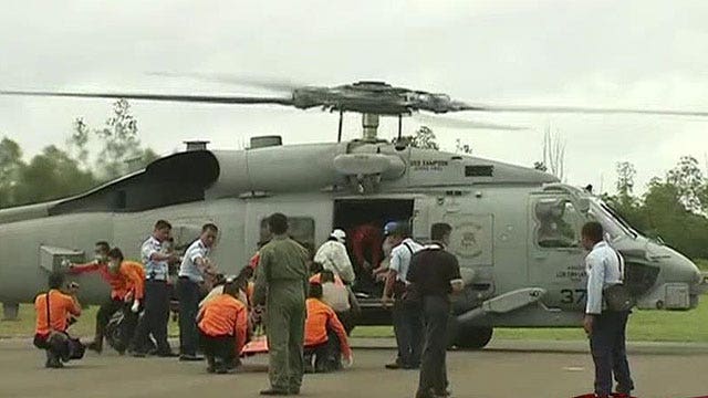 Recovered bodies offer clues in AirAsia flight investigation