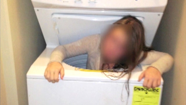 Oversized load: Tween gets stuck in washing machine