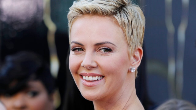 Charlize steps out in a skimpy bikini