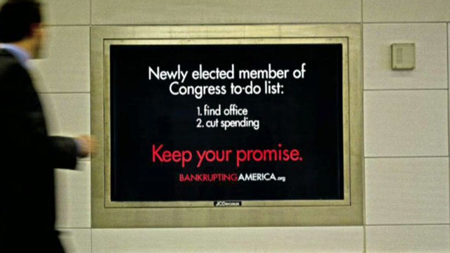 Group confronts lawmakers on spending crisis
