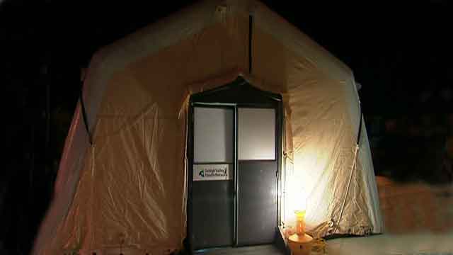 Hospital sets up tent to triage flu victims