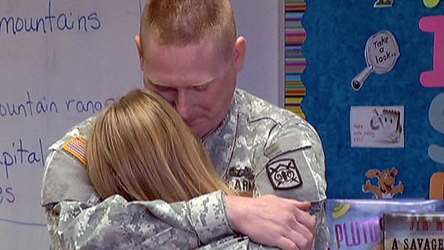 Soldier dad surprises daughter at school