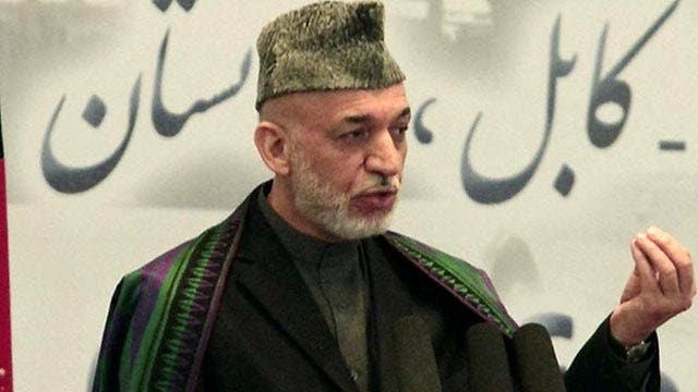 Why is Karzai ordering the release of Taliban prisoners?