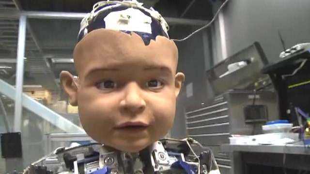Robot baby learns how to express human emotions