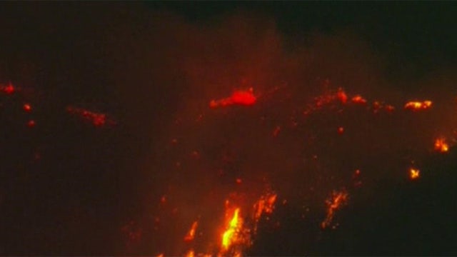 Wildfire rages through Southern California