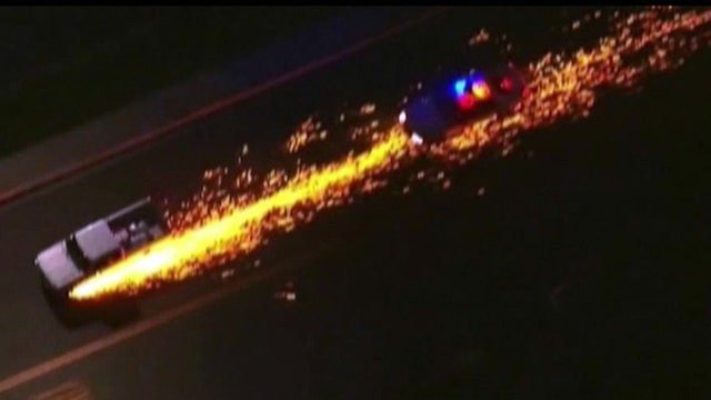 Sparks fly from truck during high-speed police chase