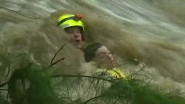 Rescuer nearly drowns after saving teen from raging water